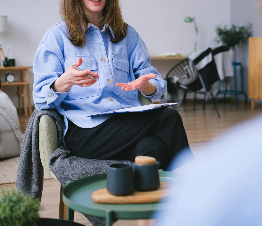 Crop psychologist consulting patient in office